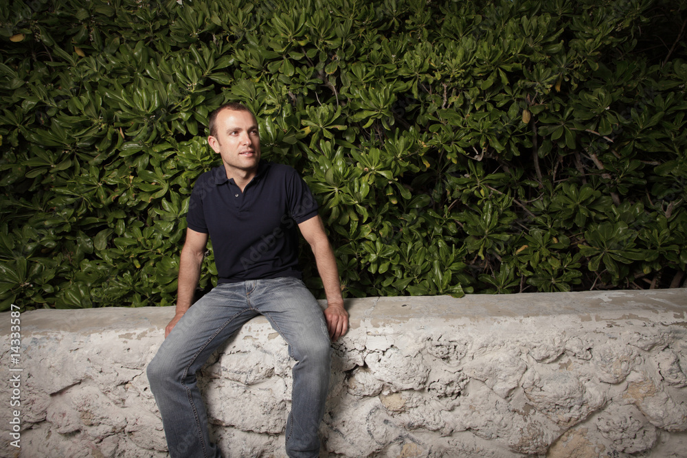 Man sitting on a ledge Man sitting on a ledge