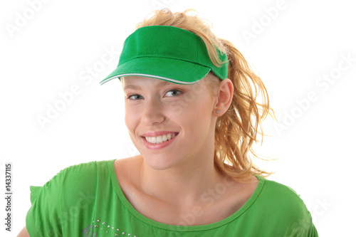 Young beautiful blond woman with green cap