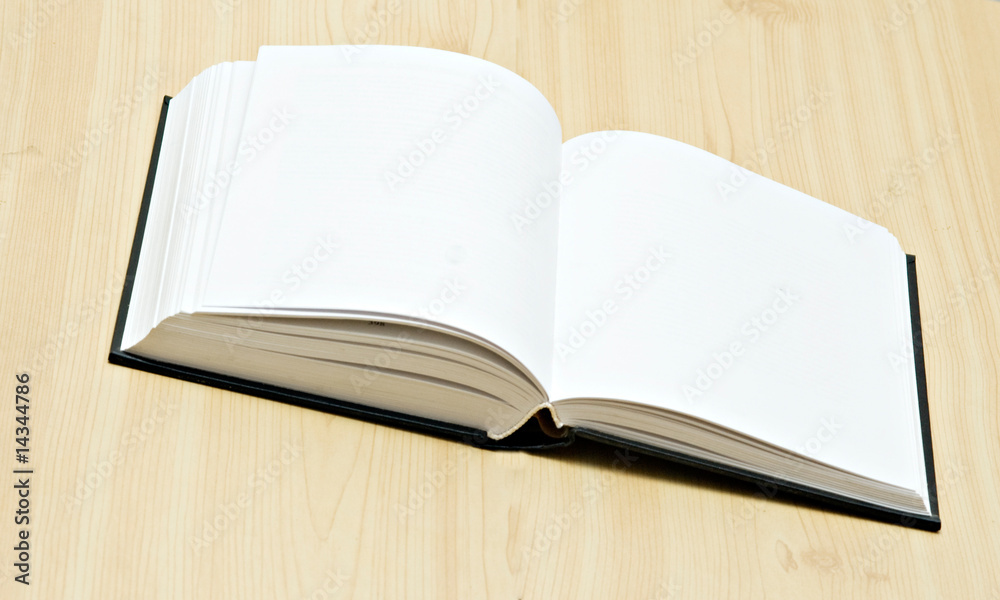 Open book on desk isolated on white background