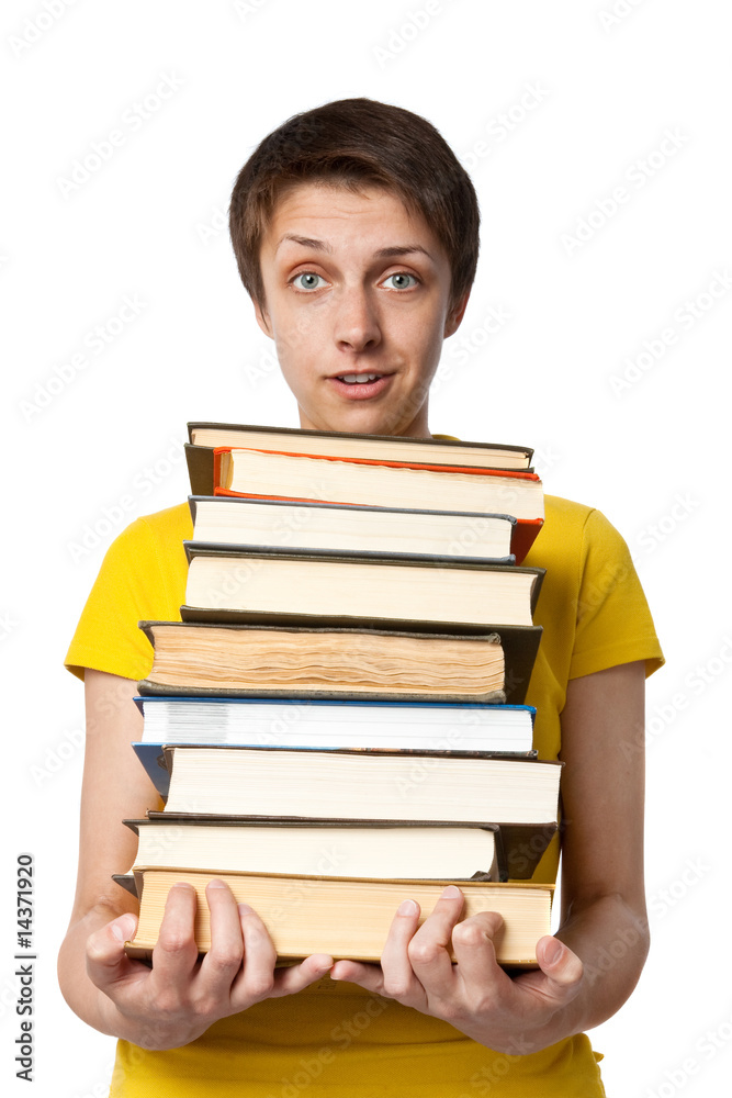 The surprised girl the student with a pile of books The surprised girl the student with a pile of books