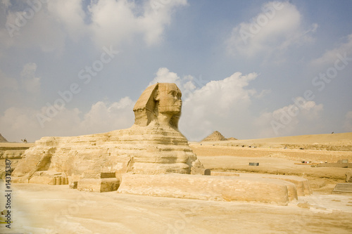 great ancient sculpture of egyptian sphinx and pyramid photo