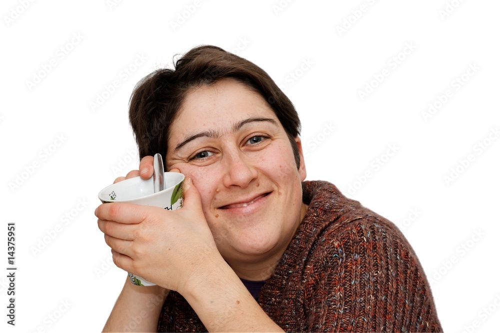Smiling mid age woman holding a cup isolated Smiling mid age woman holding a cup isolated