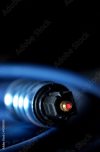 laser fiber optic link cable plug close up focus on it's tip