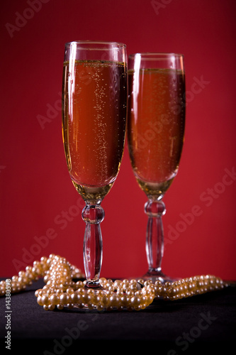 Champagne glasses with pearl necklace