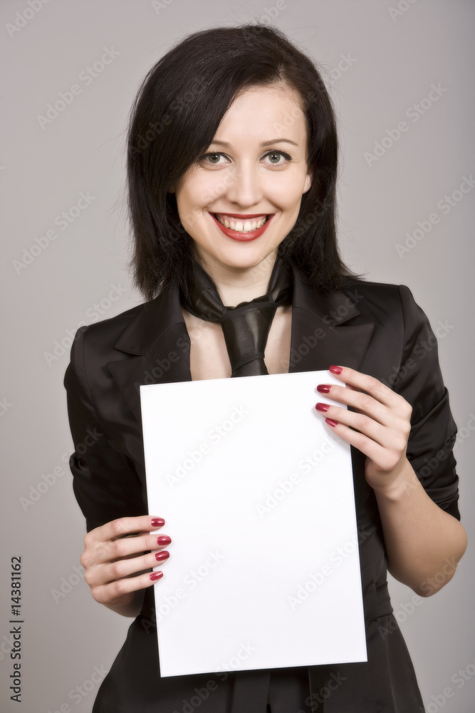 Brunette businesswoman holding white paper Brunette businesswoman holding white paper