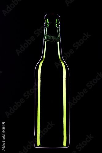 Bottle of beer against a black background