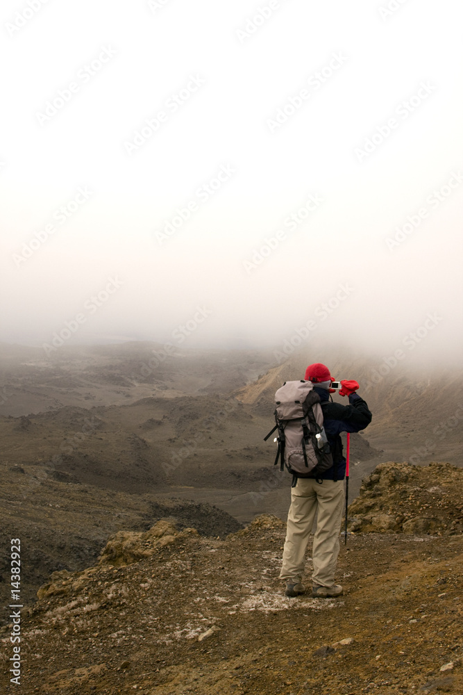Hiker Taking Photo on Mountain Top