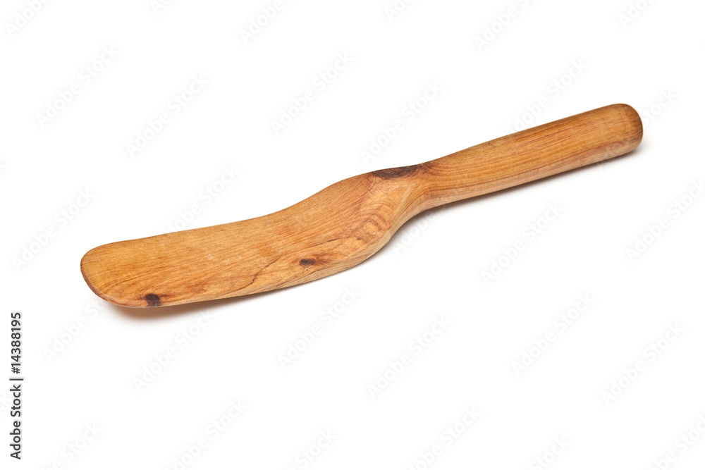 Wooden spatular isolated on a white studio background. Wooden spatular isolated on a white studio background.