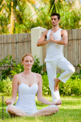 Obraz na plátně Couple Doing Yoga