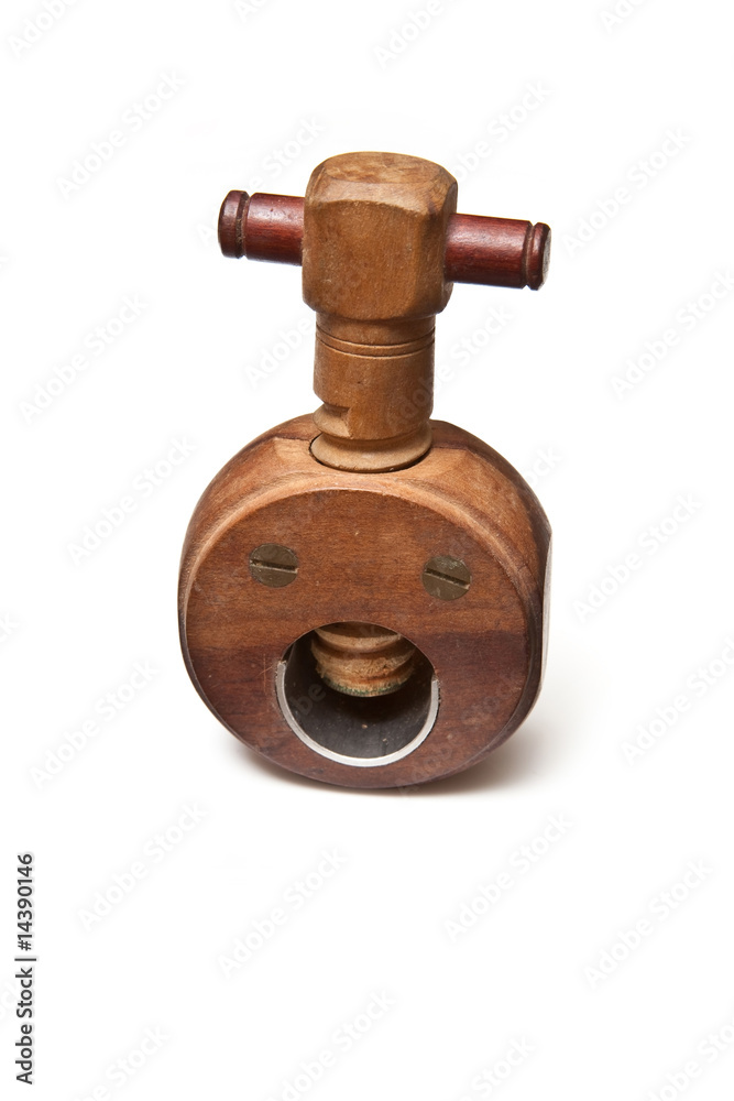 Wooden nut cracker isolated on a white studio background. Wooden nut cracker isolated on a white studio background.