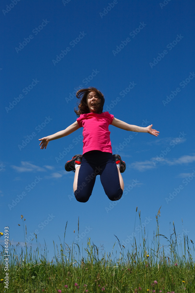 Girl jumping, running against blue sky Girl jumping, running against blue sky