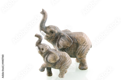 Two stone elephants isolated on white background © pholien