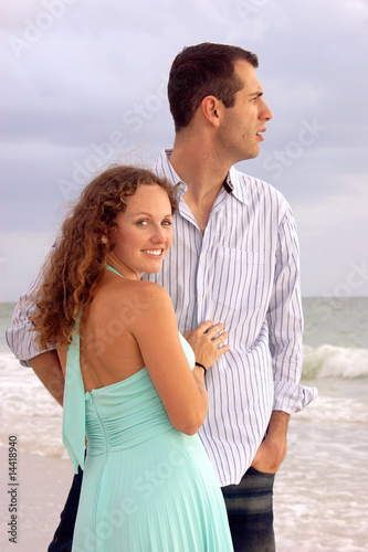 beautiful young couple at the ocean