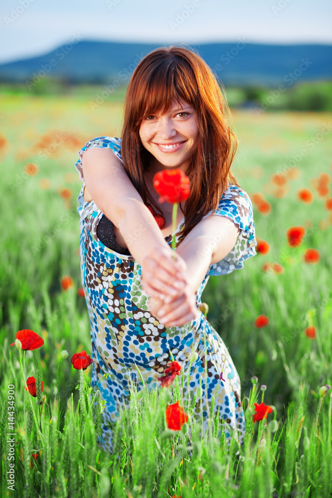 Smiling girl giving flower StockFoto Adobe Stock