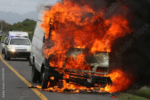 Burning Auto and Police © Duncan Noakes