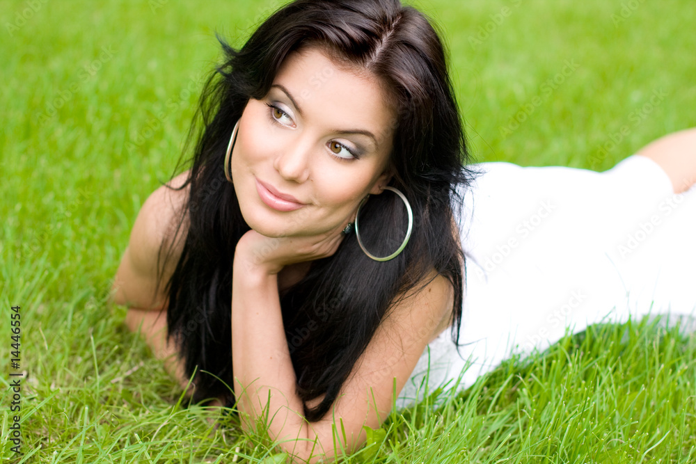 Beautiful young brunette girl on a lawn Beautiful young brunette girl on a lawn