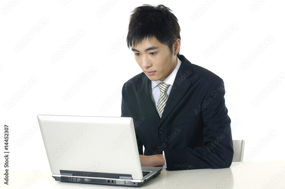 businessman working with his laptop at his desk businessman working with his laptop at his desk