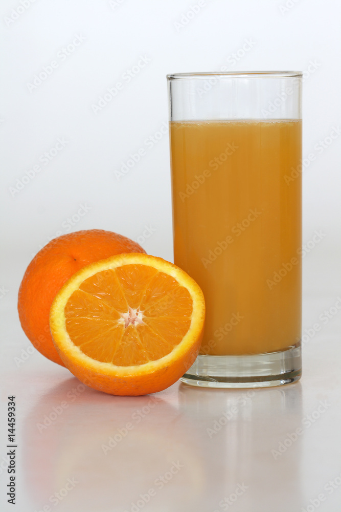 A class of fresh orange juice on a white background A class of fresh orange juice on a white background