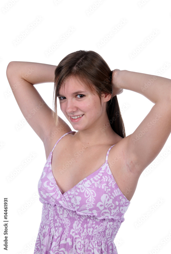 pretty teen in purple sundress with arms behind head