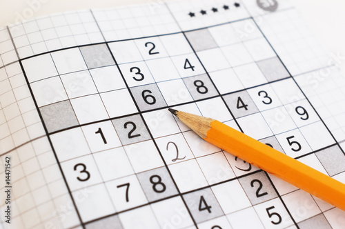 close up of sudoku game and yellow pencil