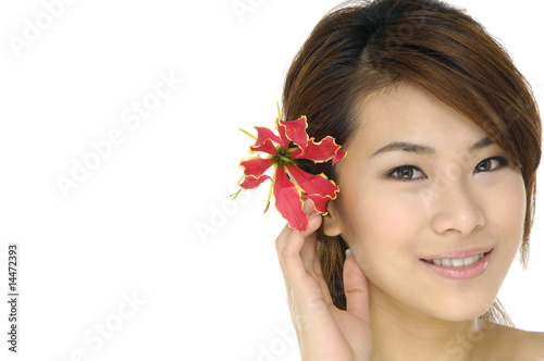 Close-up beautiful sexy young woman with red flower