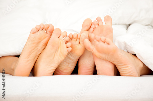 Photography a lot of feets in the bed