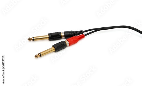 Golden headphone plug with black wire isolated