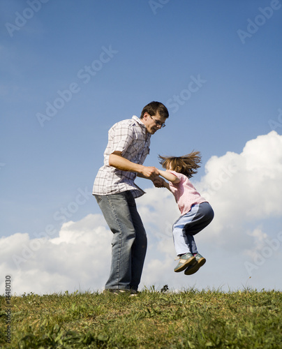 fun of father and child - jump and sky photo