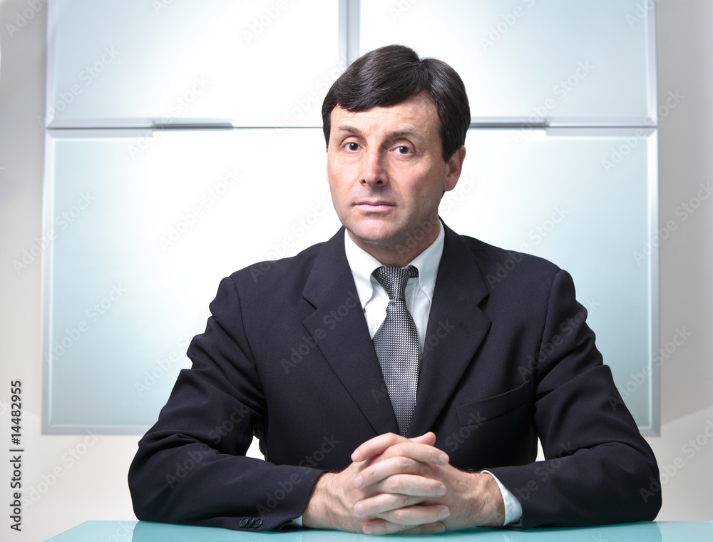 Serious businessman in his office Serious businessman in his office