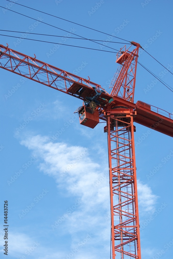 A red crane at blue sky background
