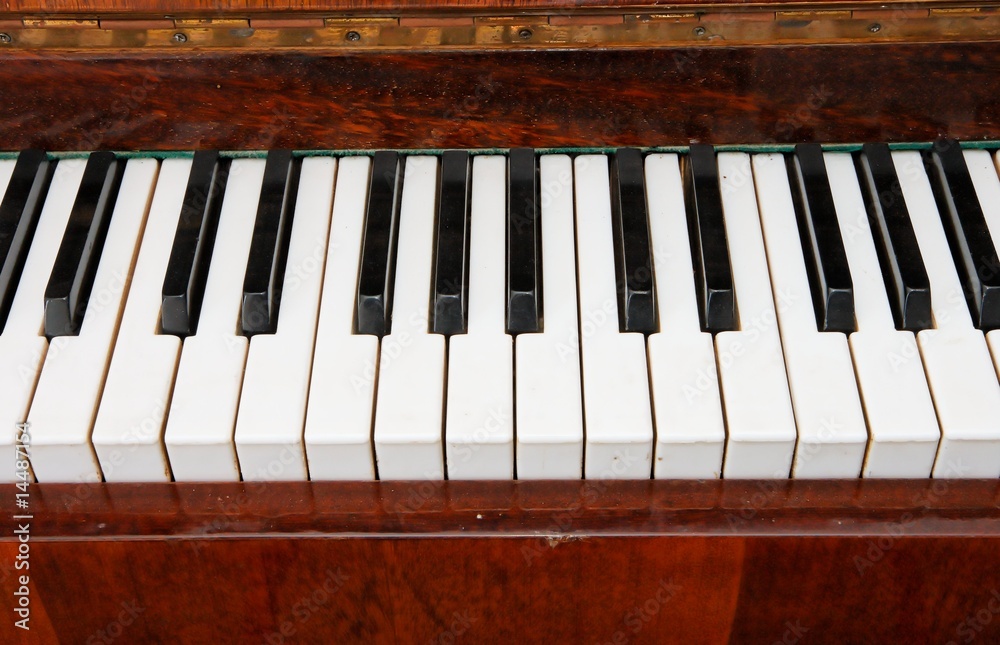Black and white keys of old piano closeup Black and white keys of old piano closeup
