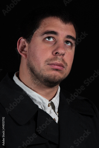 Male in thought, portrait isolated on black background