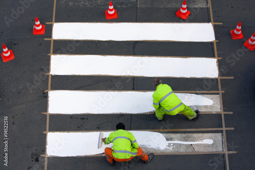 workers painting crosswalk