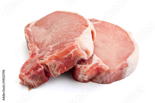 raw pork chops on white background