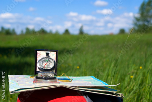 Compass and map on backpack