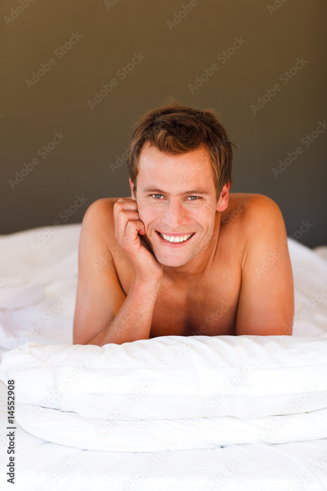 Handsome boy in bed with copyspace Handsome boy in bed with copyspace