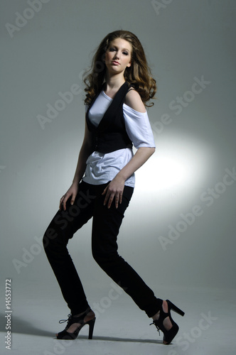 model in short dress on light background