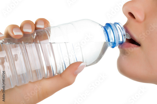 young girl with bottle of mineral water (isolated on white)