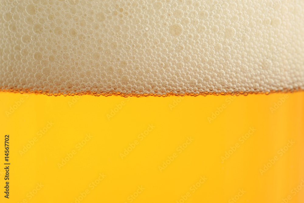 closeup of beer glass with bubbles closeup of beer glass with bubbles