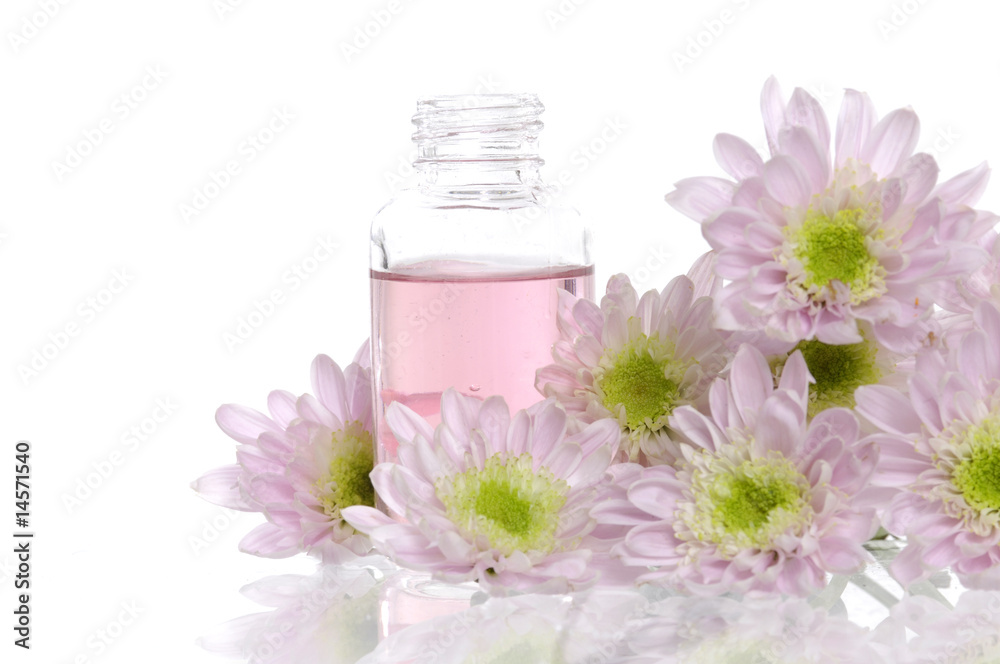 Spa bottles and daisies with reflection Spa bottles and daisies with reflection