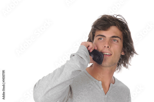 Handsome young man on cell phone isolated over white