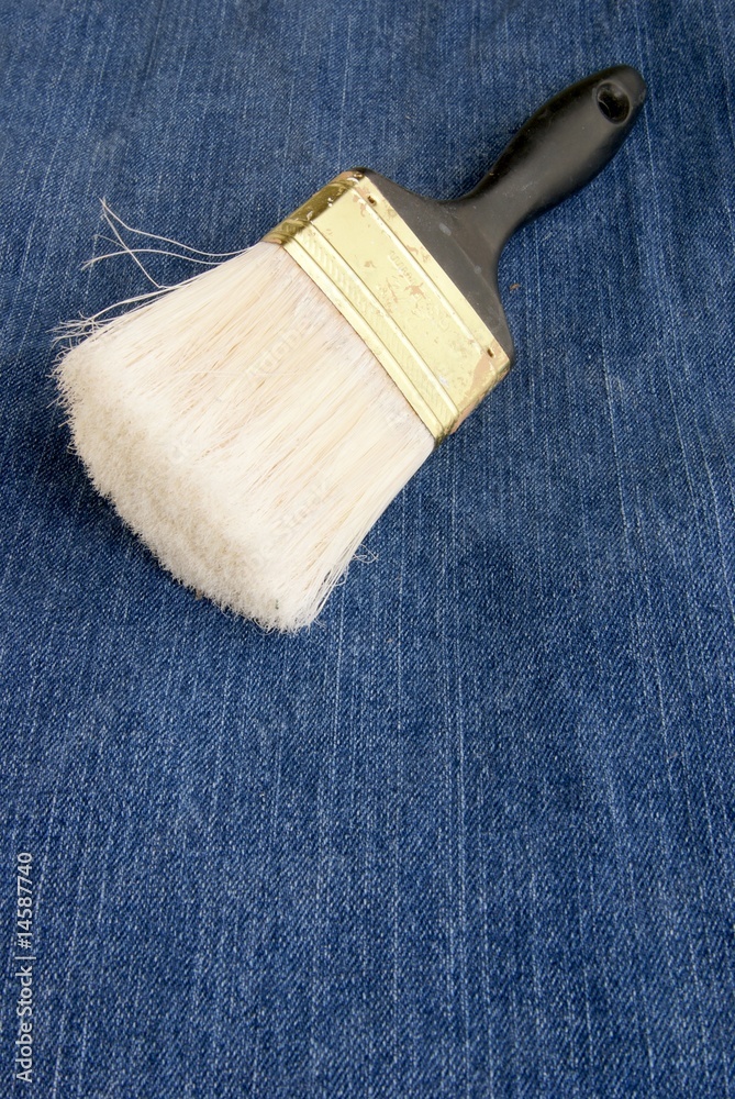 Old paintbrush with bits of dried paint on it and torn up bristles. Old paintbrush with bits of dried paint on it and torn up bristles.