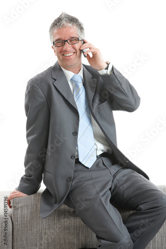 Happy businessman with mobile © nyul