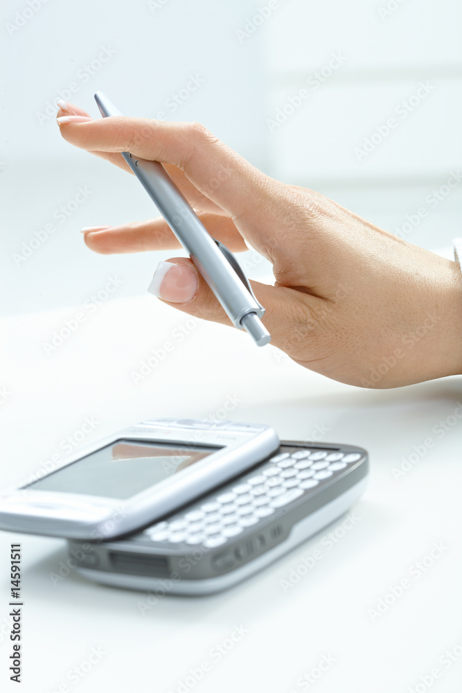 Fototapeta premium Female hand holding pen