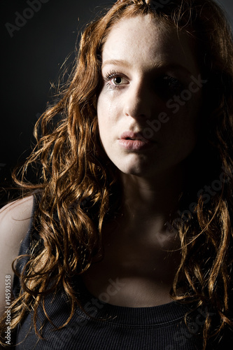 Low Key Shot of a Vulnerable Looking Redheaded Teen