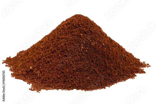 ground coffee beans in a  pile  isolated white background
