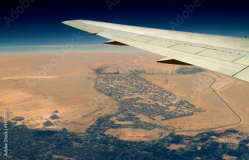 Aiplane above pyramids