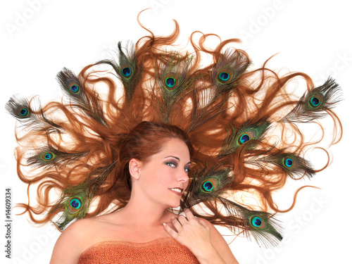 Redhead With Peacock Feathers in Her Hair on White Background