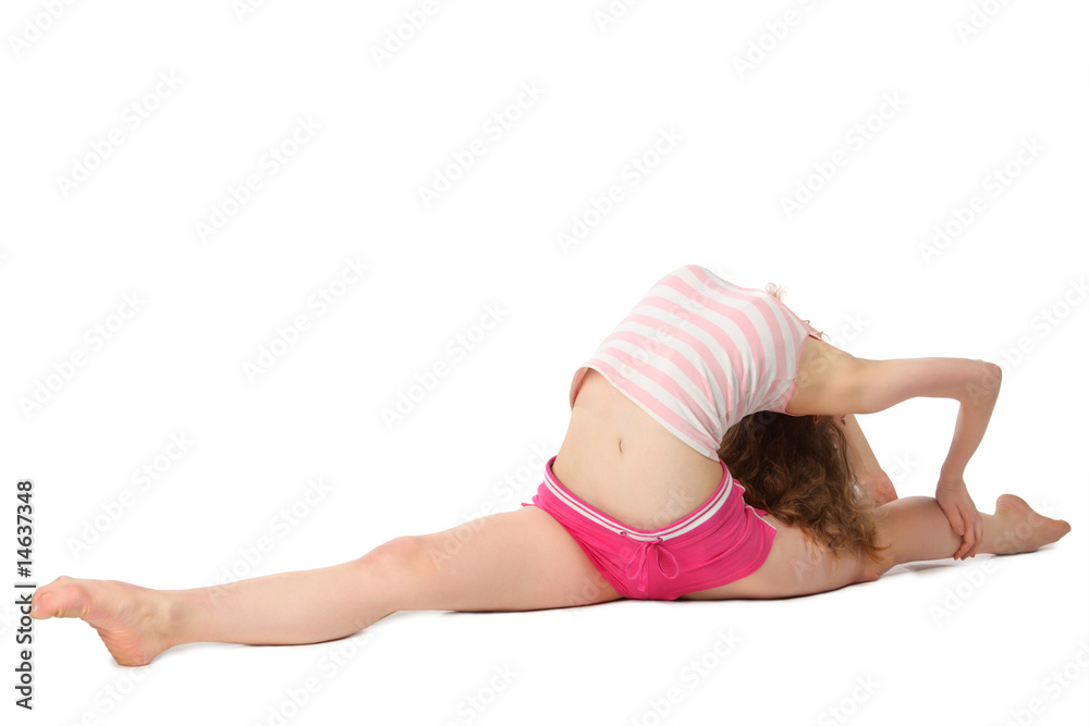 Girl in sportswear does gymnastic exercise on floor Girl in sportswear does gymnastic exercise on floor