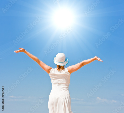 Girl in white under the sun